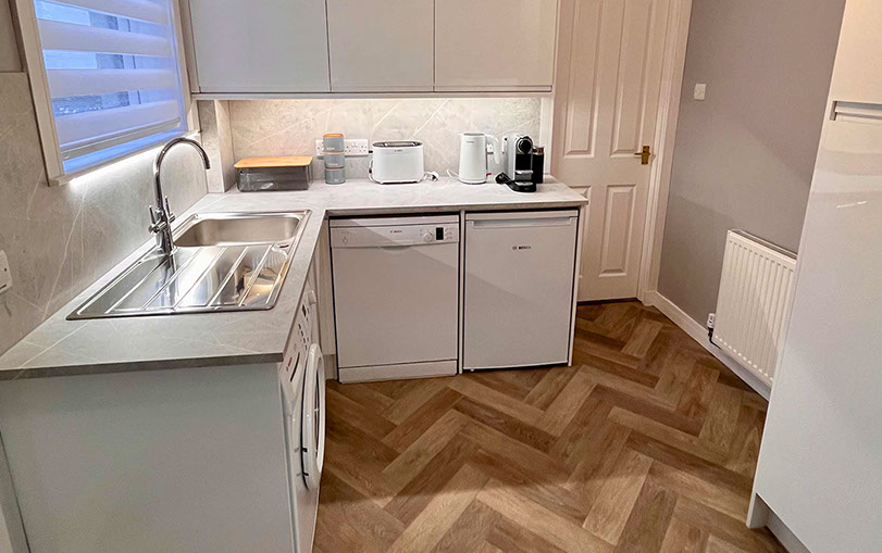 Glas Eilean View Dornie Self Catering contains a modern kitchen with Fridge and Microwave Toaster Kettle and Nespresso coffee machine 