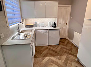 Glas Eilean View Dornie Self Catering contains a modern kitchen with Fridge and Microwave Toaster Kettle and Nespresso coffee machine 