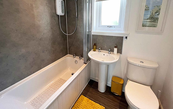 Twin bed accommodation in Dornie at Glas Eilean View with private guest seating area