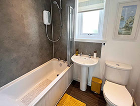 Twin bed accommodation in Dornie at Glas Eilean View with private guest seating area