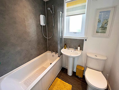 Twin bed accommodation in Dornie at Glas Eilean View with private guest seating area