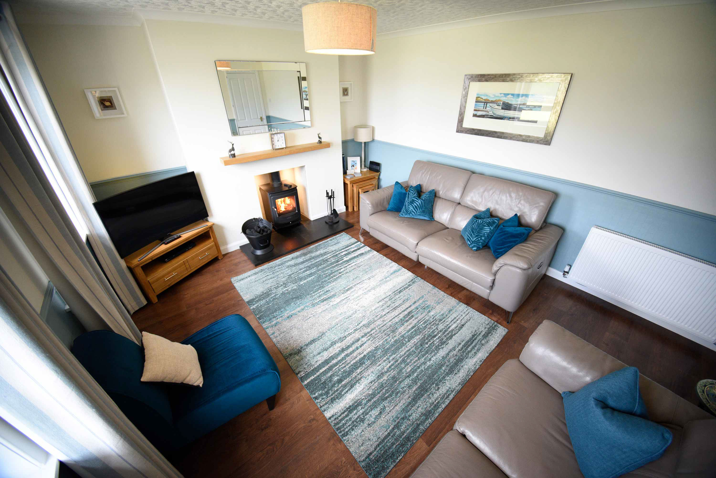 Glas Eilean View Self Catering Accommodation in Dornie living room with woodburning stove sea views