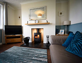 Glas Eilean View living room contains a woodburning stove sea views smart tv WIFI Superfast internet 