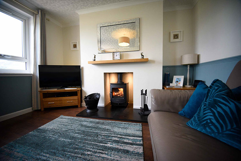 Glas Eilean View living room contains a woodburning stove sea views smart tv WIFI Superfast internet 